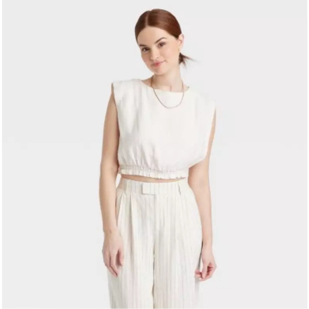 Women's Slim Fit Extended Shoulder Gauze Tank Top - A
New Day™ Cream